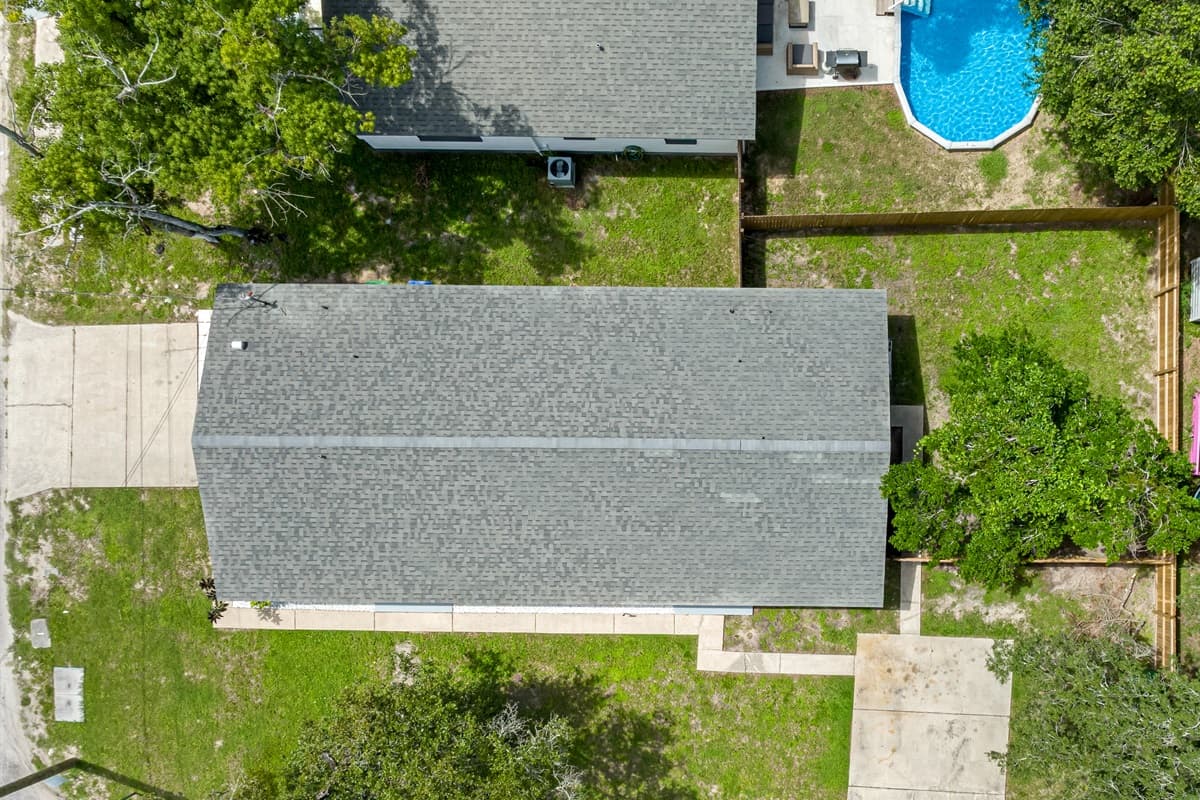Top view of our beatiful property showcasing the stunning heated pool and lounge area at the back of the property. Love what you see? Ask us questions and send us an inquiry as soon as possible!