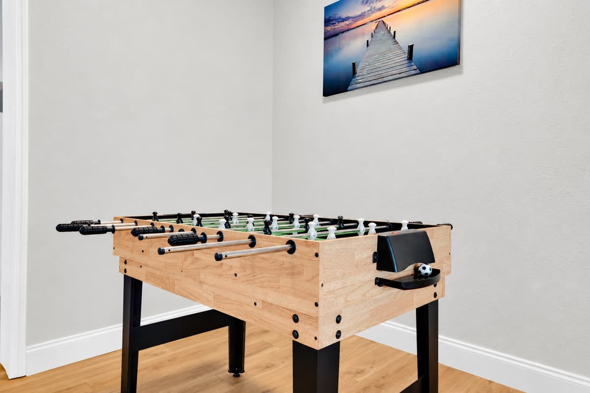 The foosball table earns its keep on day one. Between beach mornings and pool afternoons this is where the rivalries start, and where the tournament somehow ends up running well past everyone's bedtime.