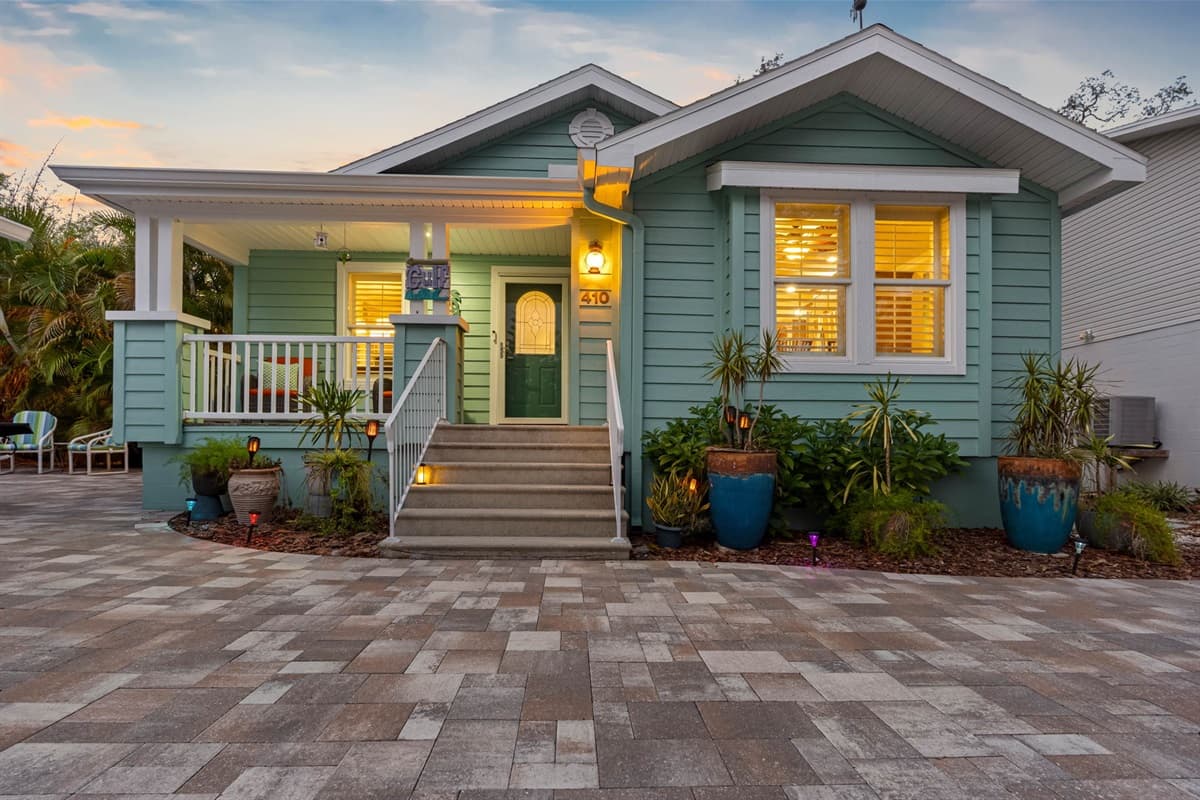 A delightful front porch and bright coastal colors give this home a relaxed, beach-town feel.