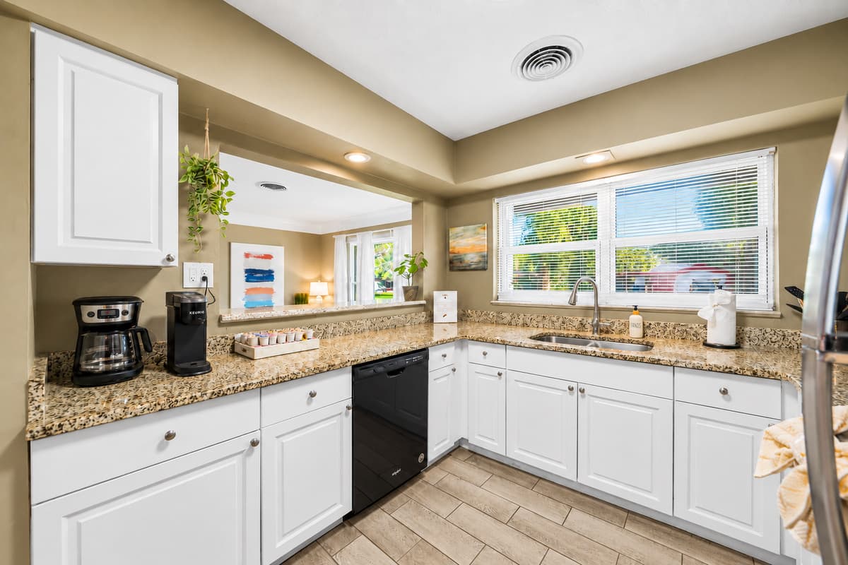 Spacious kitchen featuring plenty of counter space, natural light, and modern appliances.