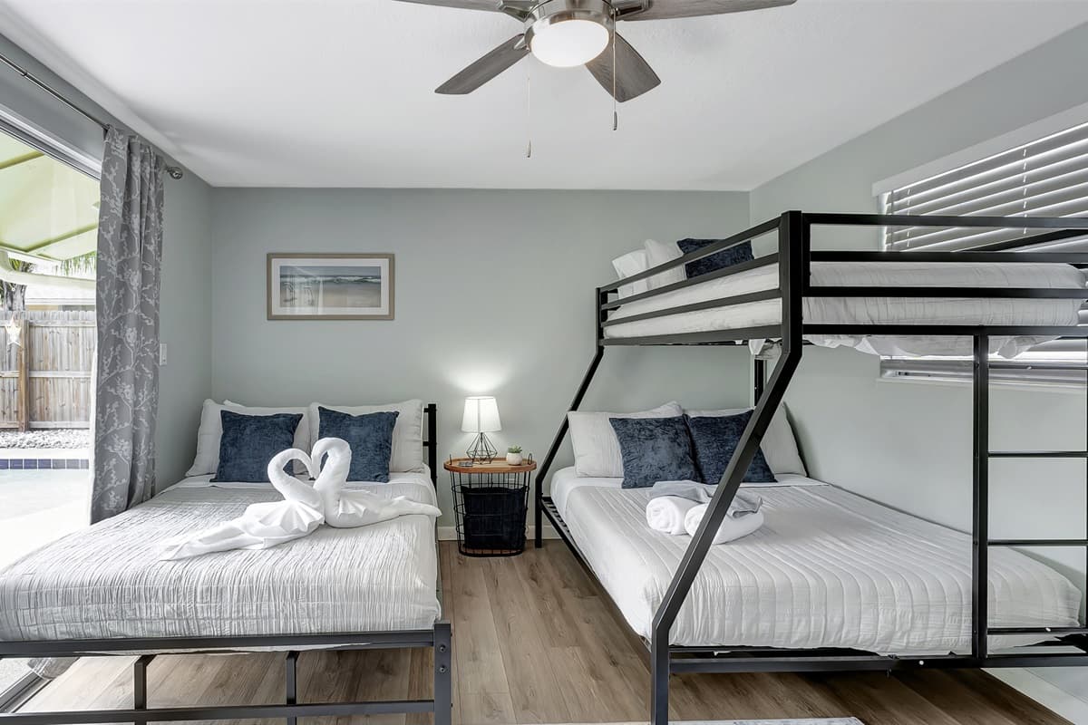 A queen-size bed invites you to unwind in comfort, while a bunk bed adds an element of adventure for those traveling with friends or family