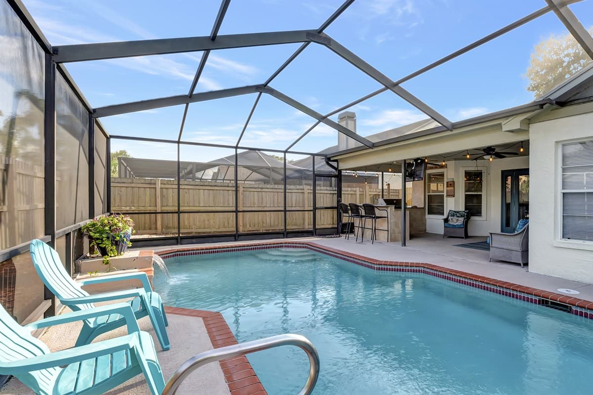 Relaxation and enjoyment awaits beneath the shelter of our inviting screened pool area.