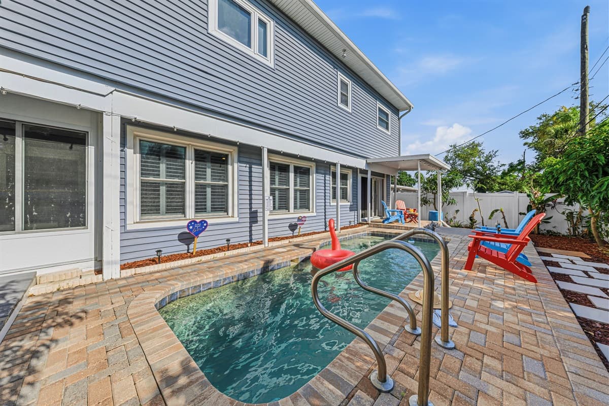 Backyard view showcasing the pool and home exterior—spacious, clean, and beautifully maintained 