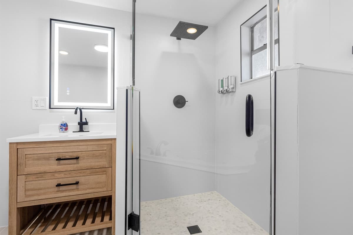 Completely modern and spacious bathroom with bathtub, sink, toilet and walk in shower. Enjoy a relaxing bath after a long day of travel from your home to your home away from home.