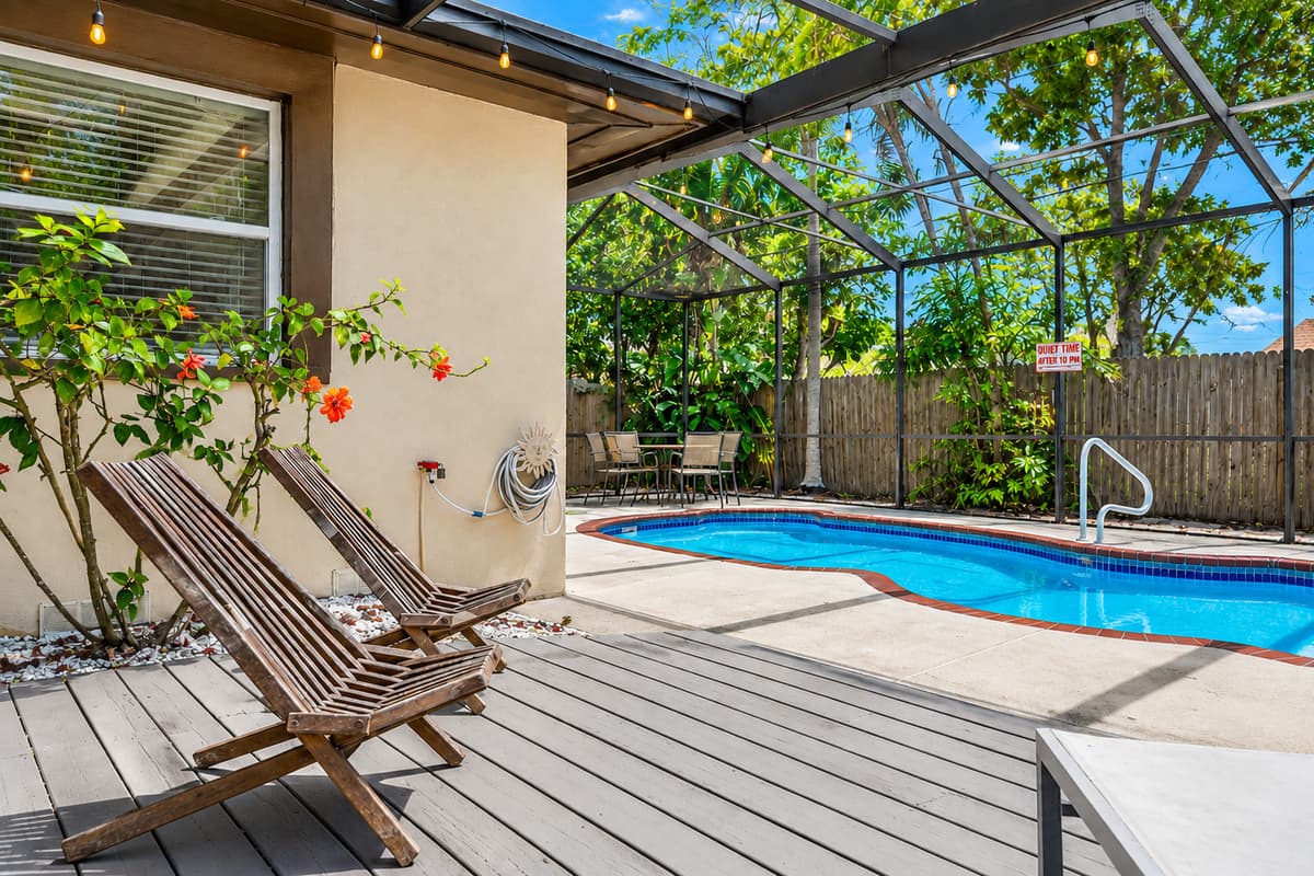 Relaxing lounge area beside the pool, perfect for soaking up the Florida sunshine.