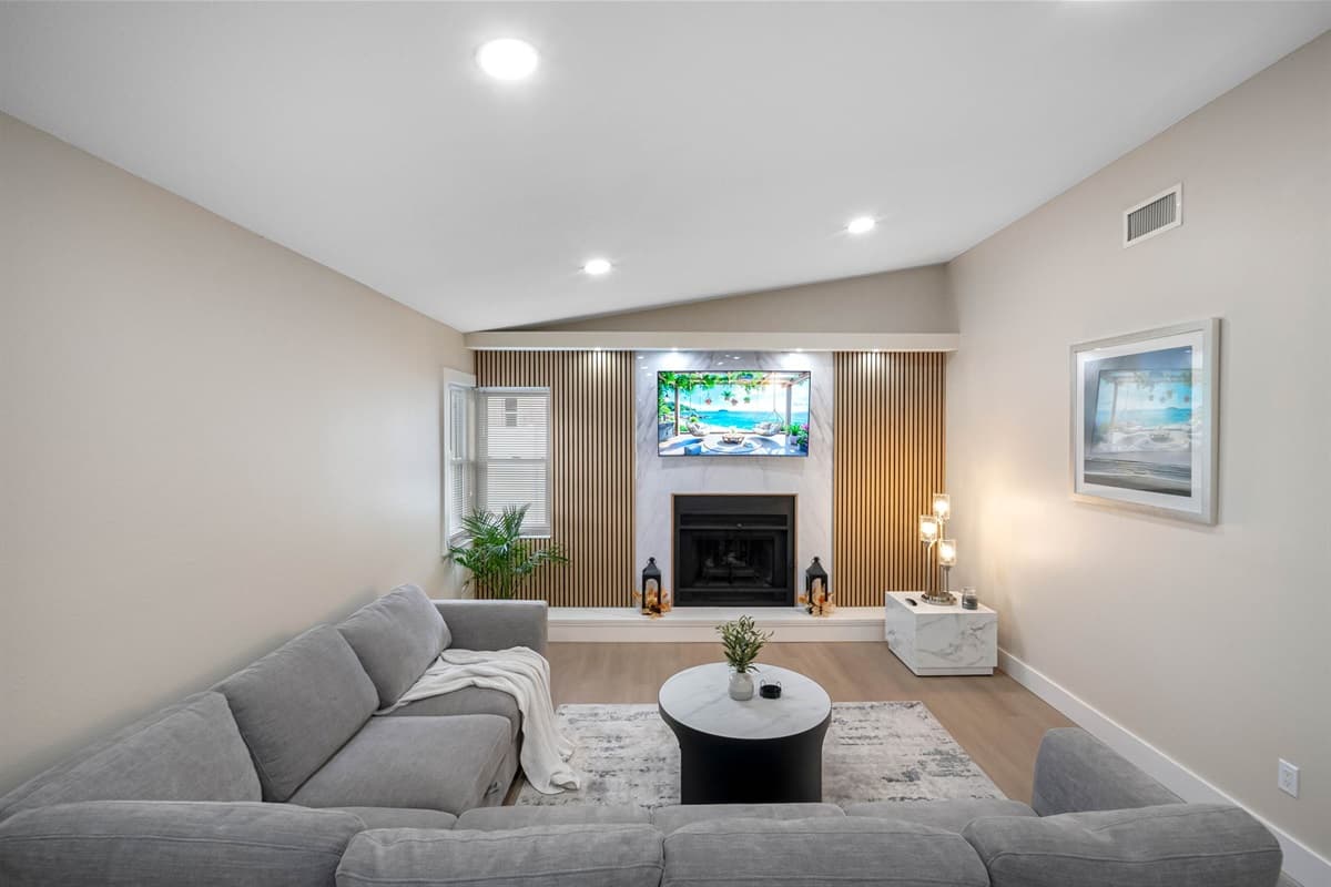 Gather around in this bright family room featuring plush seating, modern décor, and a relaxing ambiance.