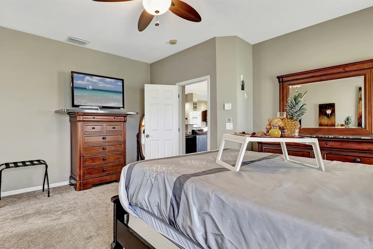 Natural light cascades through the windows, enhancing the room's airy ambiance.