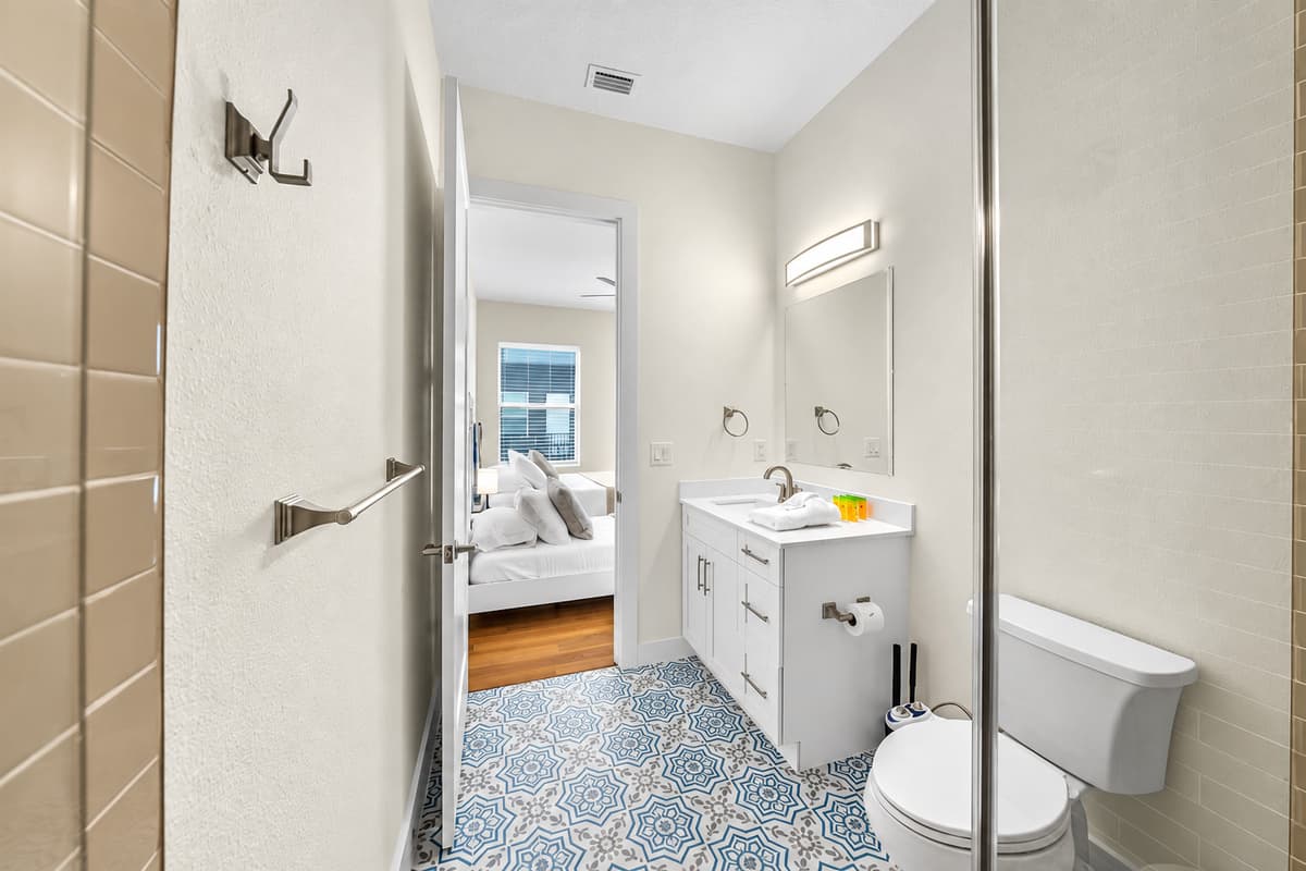 Clean and modern bathroom with vanity and tub/shower combo.
