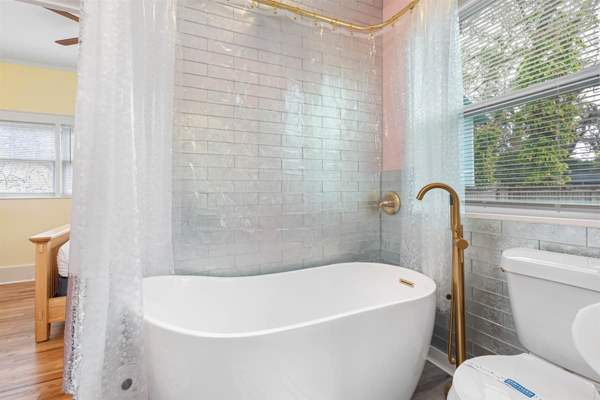 The Jack-and-Jill setup allows direct access from the bedroom to the kitchen, making it incredibly convenient for guests to freshen up without having to navigate through common spaces.