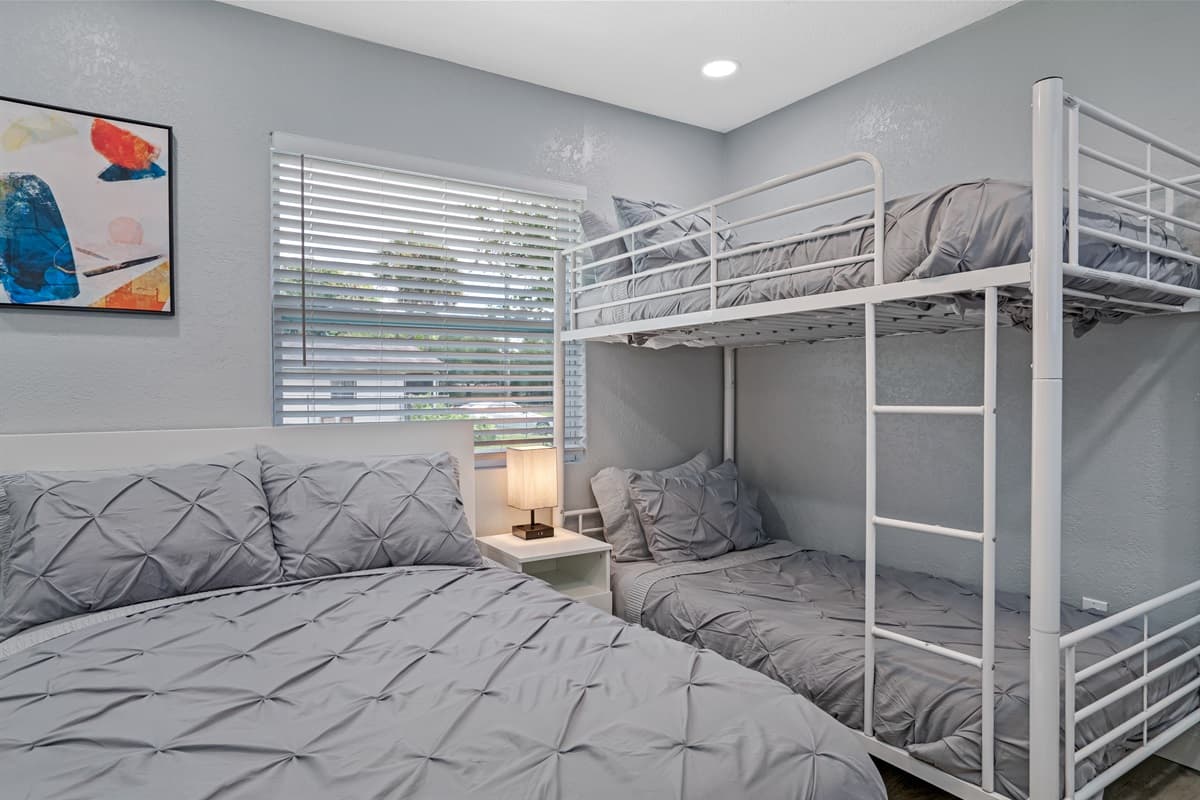 Magnificent bedroom with queen sized bed, single bunkbed, closets for storage and smart TV. Great room for families with kids or group of friends.
