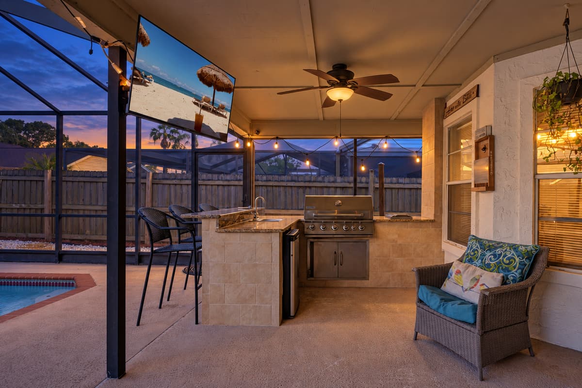 This is our patio area,  inviting seating arrangements for your comfort and a compact outdoor kitchen equipped with a grill.