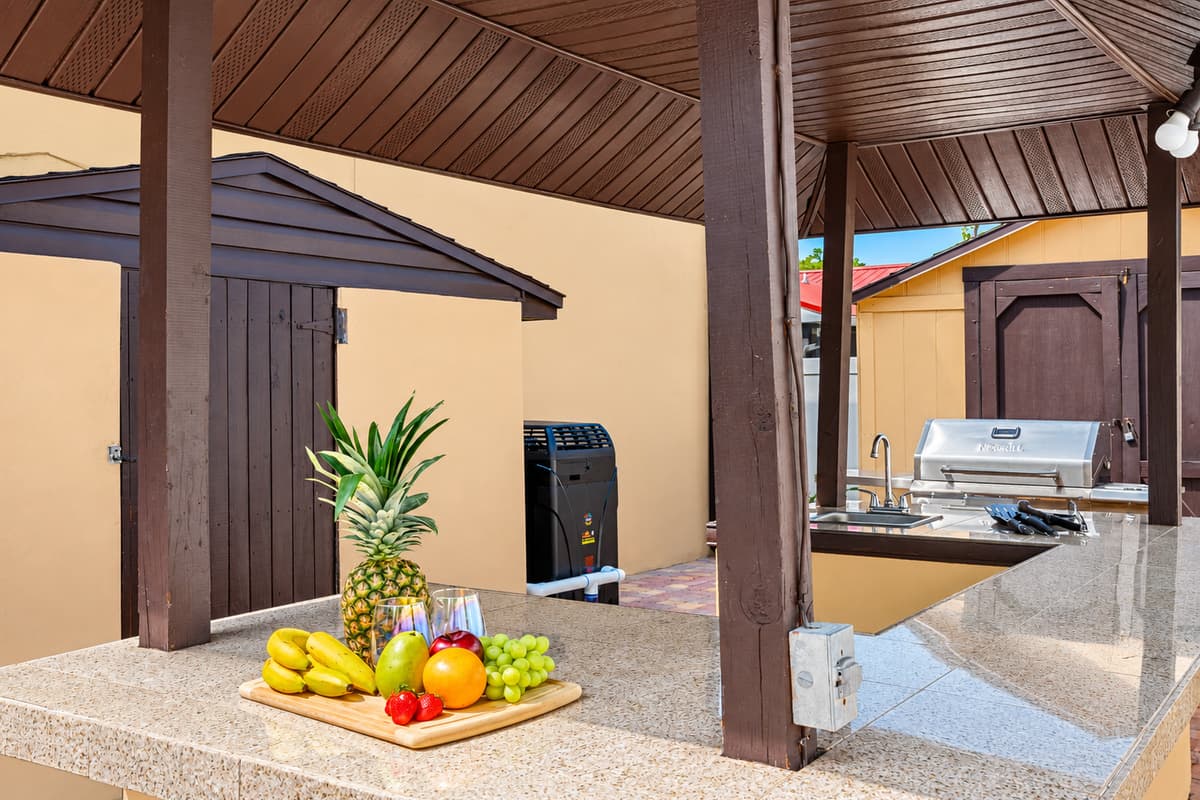Our outdoor grilling station features top-of-the-line grills, smokers, and other cooking equipment, as well as ample counter space and storage for all your cooking essentials.
