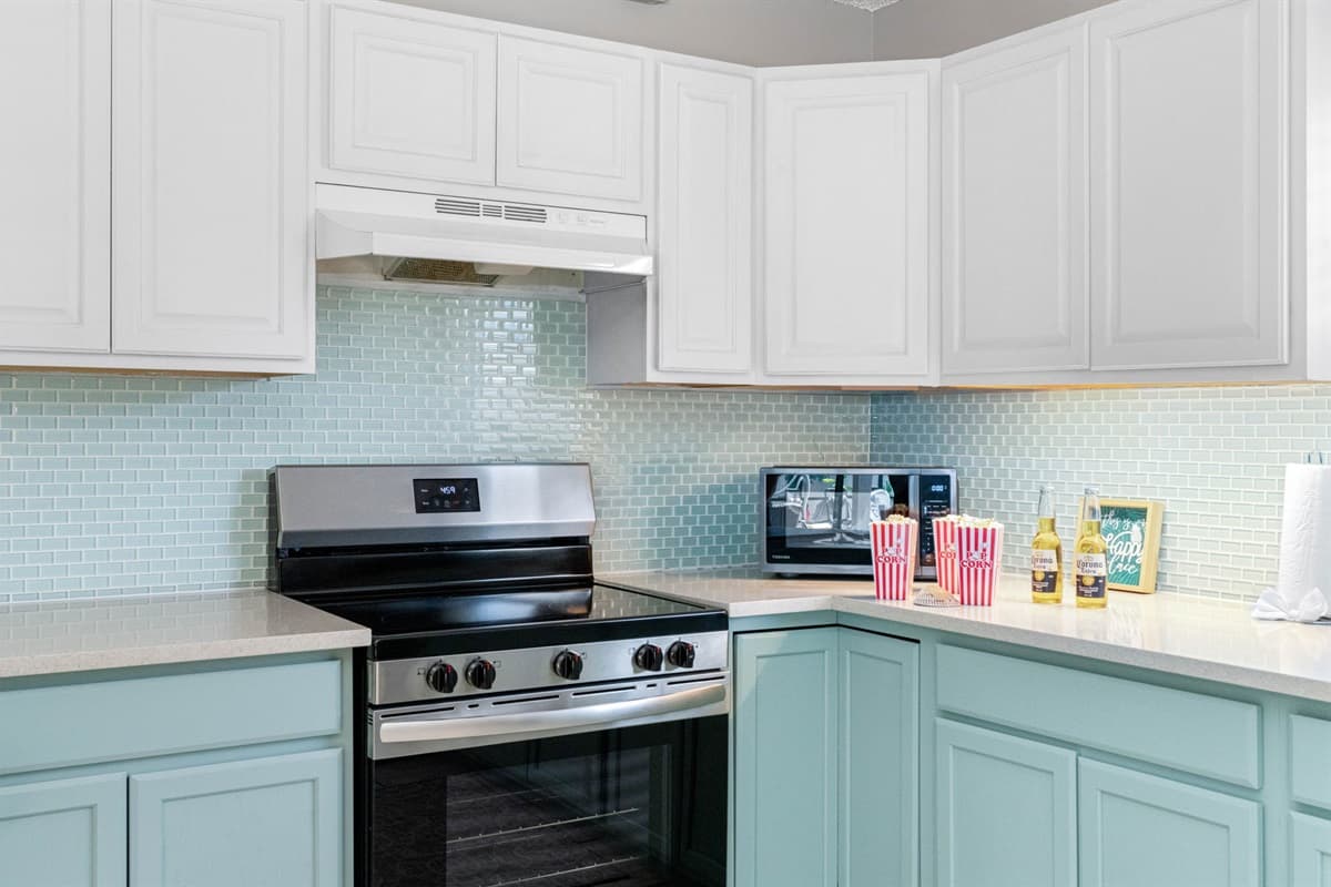This spacious, fully-equipped kitchen combines stylish design with everyday functionality—perfect for everything from a sunrise coffee routine to a full family dinner after a day exploring.