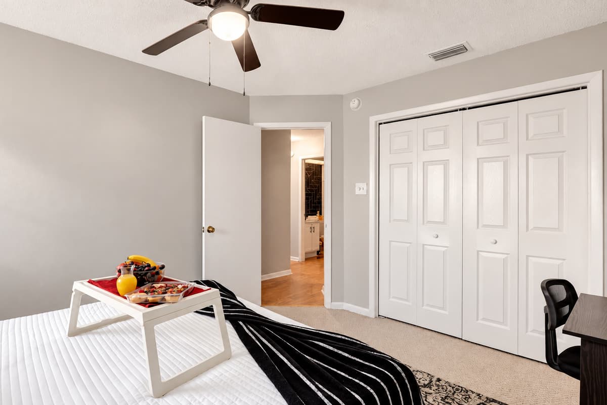 This inviting space boasts a generously spacious king-size bed adorned with cozy linens, creating a haven of relaxation.