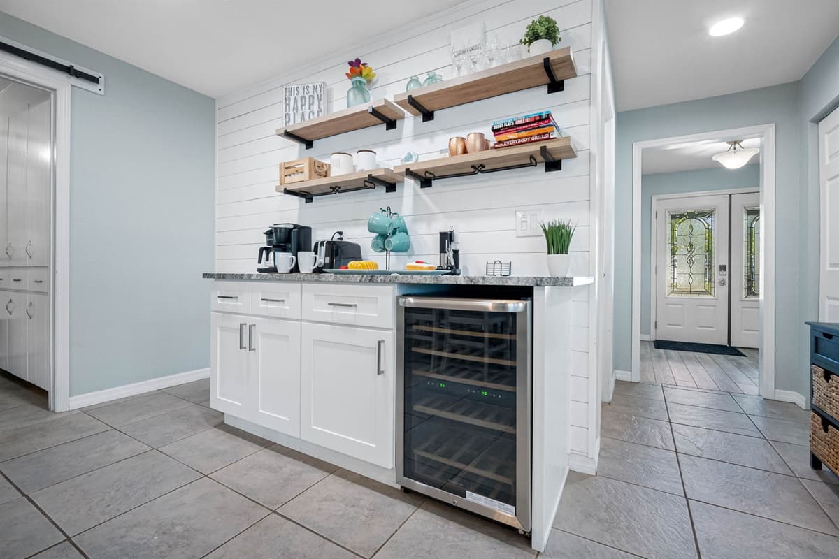 From the sleek wine cooler to the modern light fixture, every detail adds both style and function.