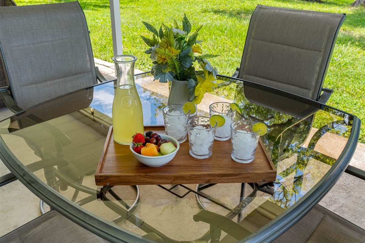 This inviting outdoor setup is ideal for slow mornings, casual conversations, or refreshing afternoon breaks in the Florida sunshine.