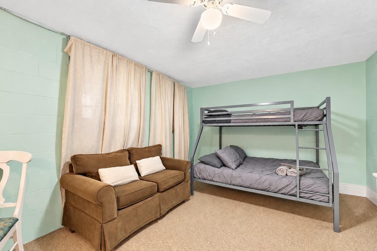 Embark on an extraordinary experience as you enter this exceptional bedroom, carefully curated to offer a perfect blend of comfort and entertainment.
