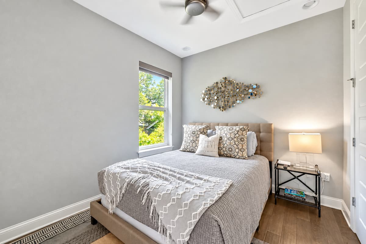 The bedroom features a snug queen-size bed, ensuring ample space for a peaceful night's rest.