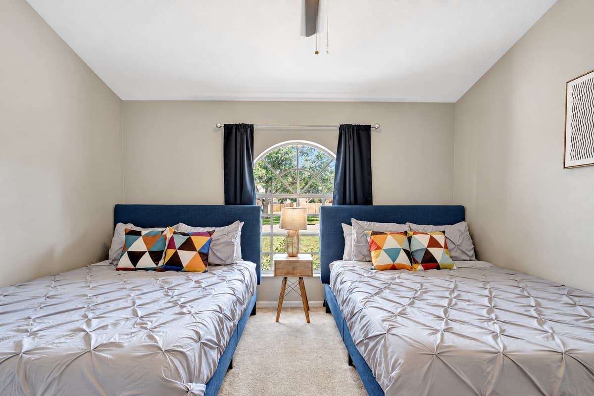 Indulge in the comfort of our queen-size beds, enjoy the natural beauty streaming through the large window, and make use of the thoughtfully designed amenities to create your ideal retreat.