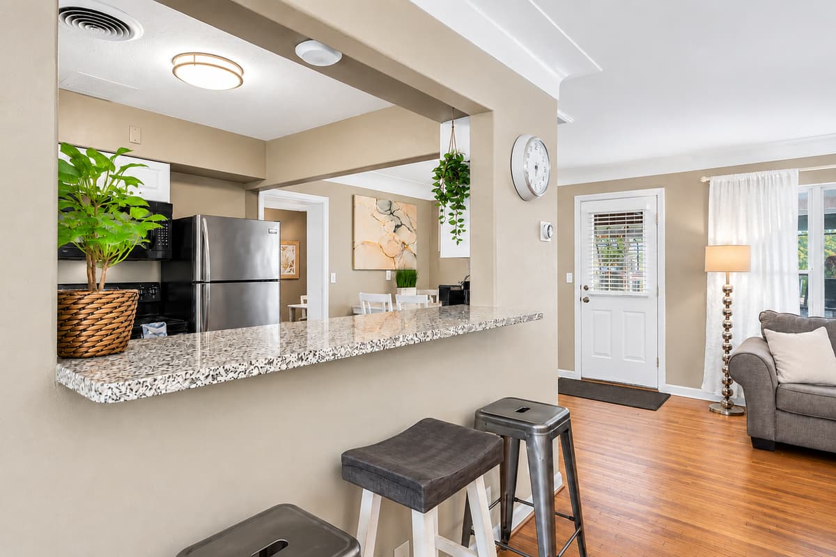 Cozy breakfast bar seating area connecting the kitchen and living room spaces.