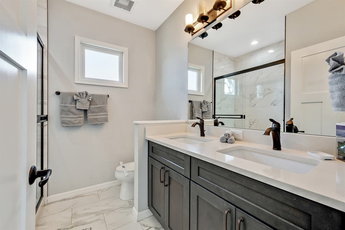 Immerse yourself in the spa-like atmosphere, where sleek fixtures and tasteful finishes create an ambiance of sophistication.