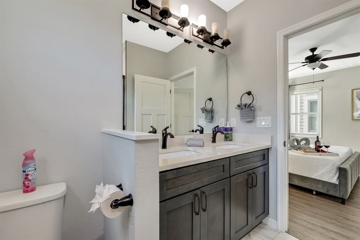 The ensuite bathroom is a masterpiece of design and functionality, offering a private oasis within the suite.