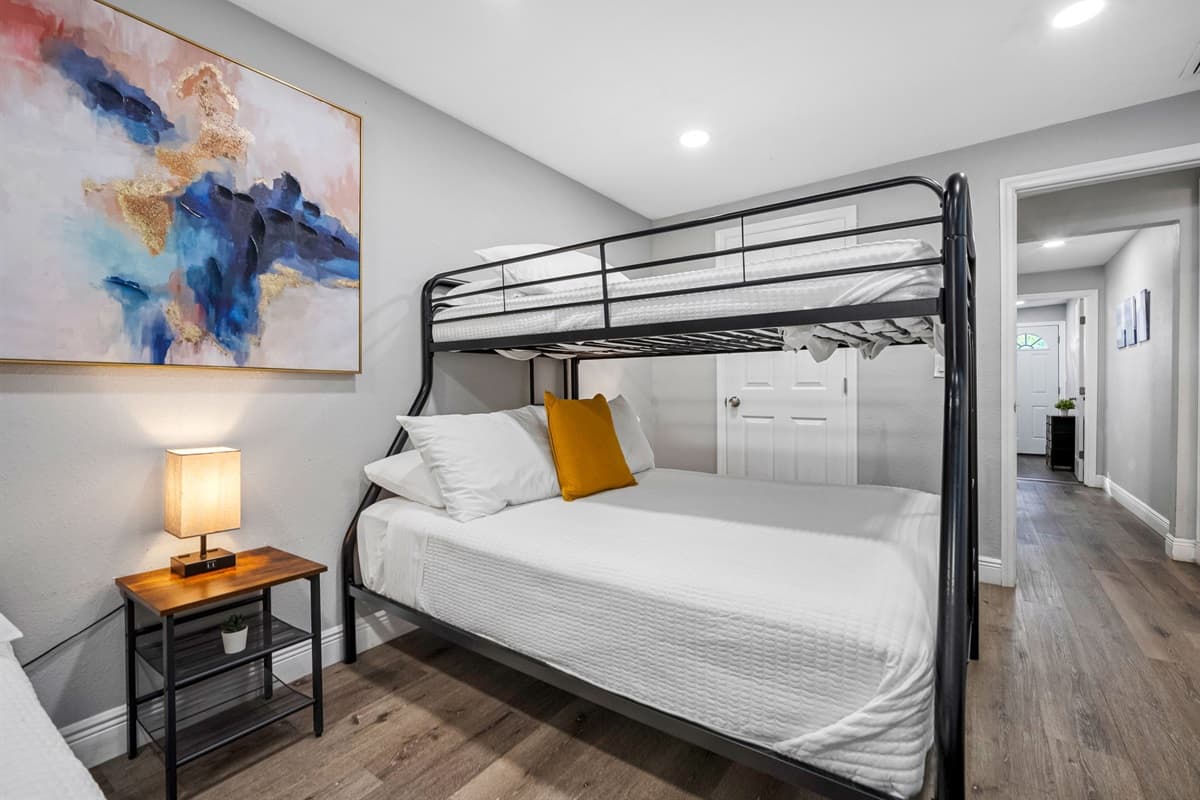 A versatile room setup with double bunk beds, perfect for both kids and adults.