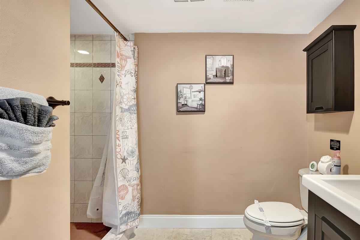 Elevate your bathing experience in this chic and inviting space – a haven of relaxation and sophistication awaits you!