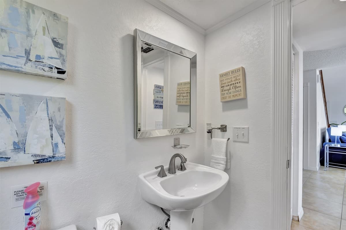 The bathroom features a sleek and modern design, with clean lines and high-quality finishes that create a pleasant and inviting atmosphere.