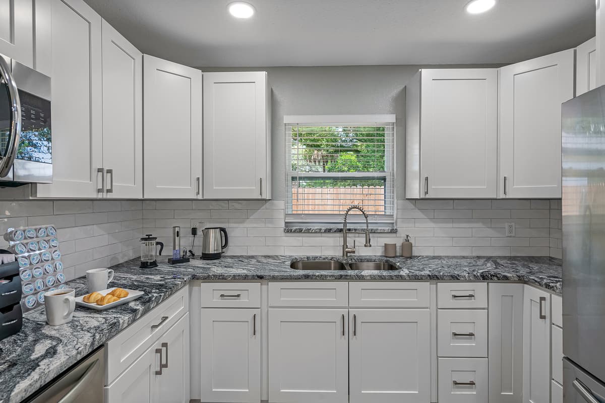 Our beautiful kitchen has a lot of storage so you don't have to worry about stuff in the kitchen getting cluttered. Have the best time with family and friends with great meal during your stay! Book this property now!