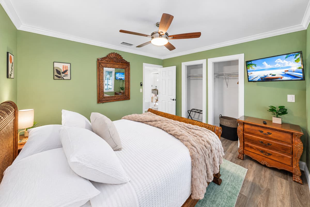 The bedroom features a cozy queen-size bed and soothing décor, creating a relaxing retreat.