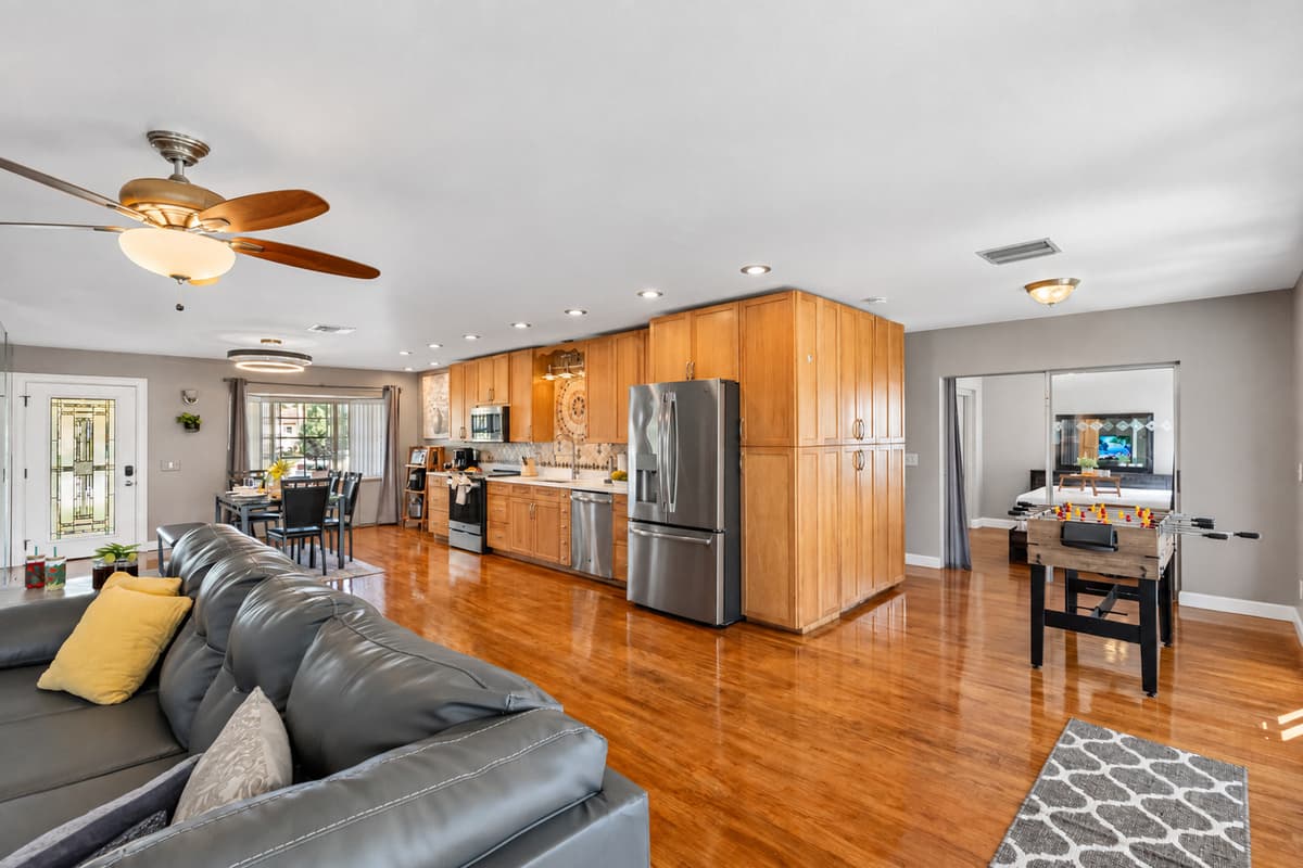 Flowing effortlessly into the kitchen and dining area, this living room offers a versatile layout for both daily living and gatherings.