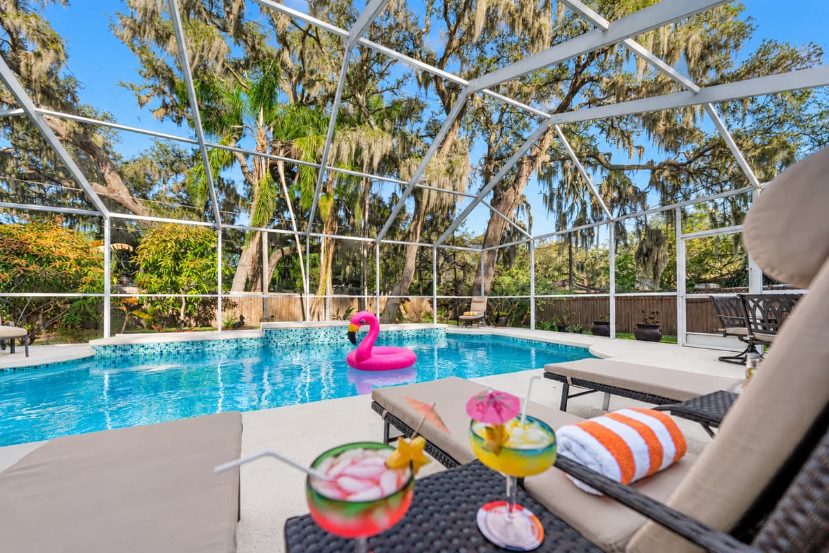 Relax poolside under the screened lanai with comfortable lounge chairs all overlooking the sparkling private pool.