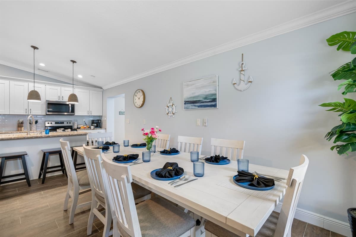 With its strategic location, the dining table allows for seamless interaction between the kitchen and dining areas, making meal service and cleanup effortless.