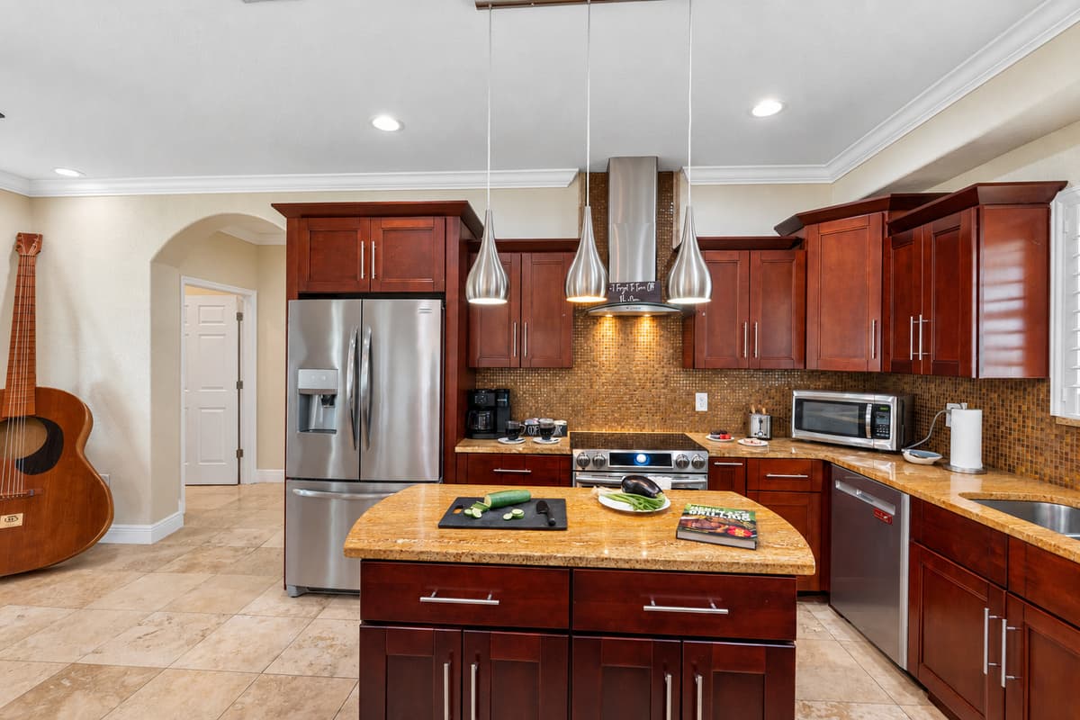 The kitchen also includes dishes, glasses, mugs, silverware, mixing bowls, cutting boards, and measuring cups—just bring your ingredients and creativity!
