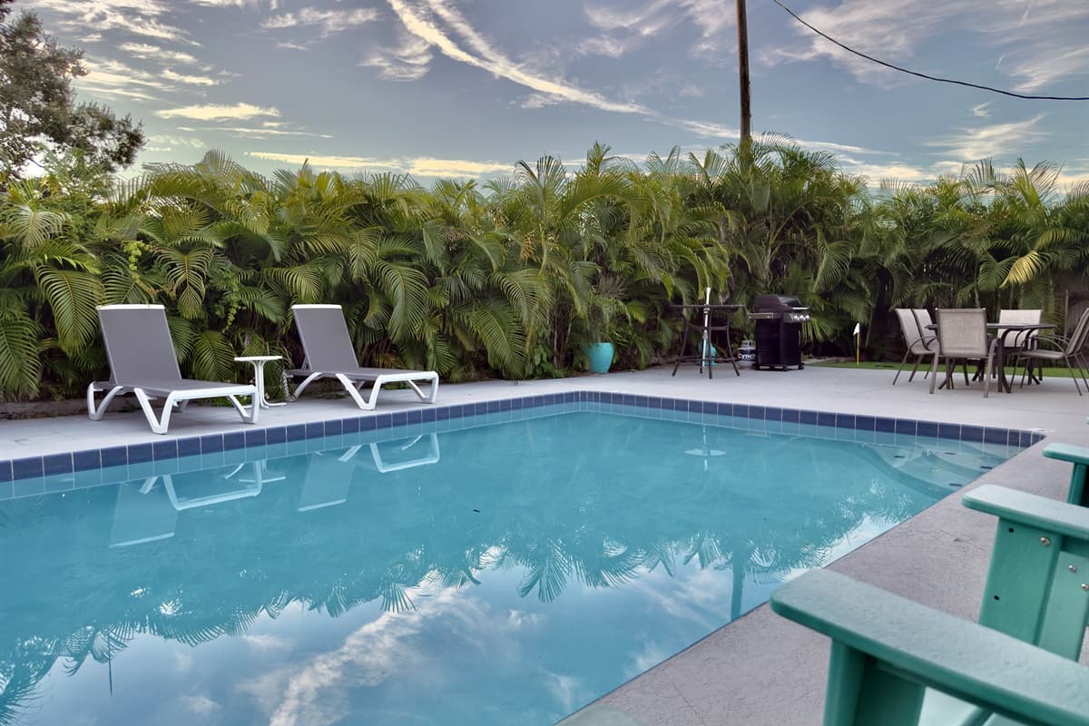 Sparkling clean and inviting, the pool is the centerpiece of this tropical retreat.