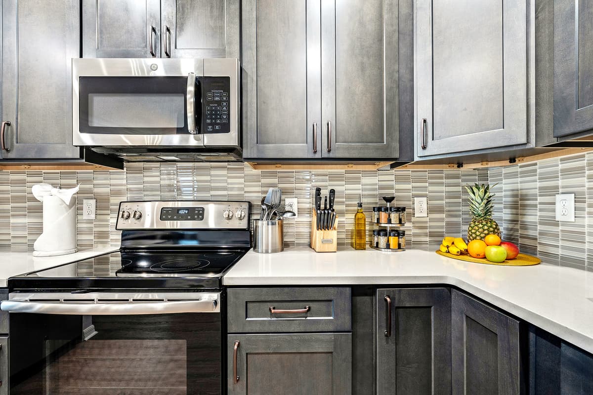 The thoughtful organization of the kitchen extends beyond the appliances and into the storage solutions.