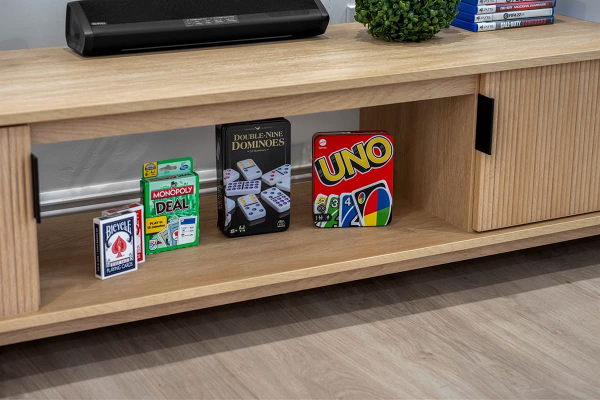 From fast-paced video games to laid-back board games, this home is stocked for both digital and analog fun.