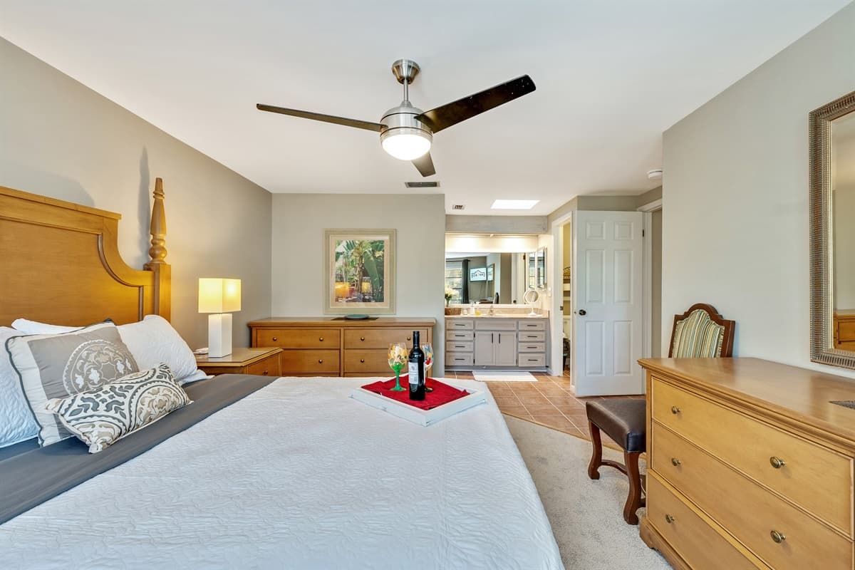 Sink into the sumptuous queen-size bed, adorned with crisp linens and plush pillows, promising a restful night's sleep.