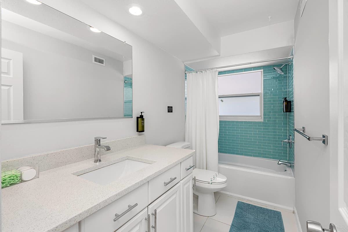 This well-appointed bathroom features both a tub and a shower, offering flexibility and comfort for your personal care routine.