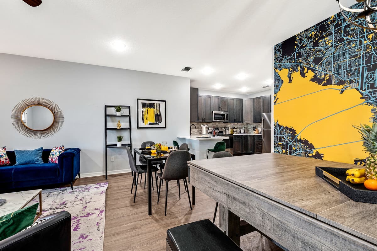 Welcome to our elegantly designed dining area, featuring a stylish 4-seater table strategically positioned to seamlessly connect with both the living and kitchen spaces.
