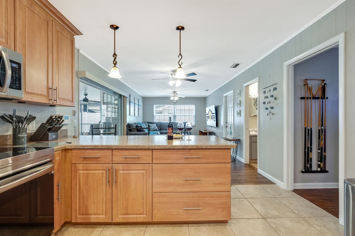 The kitchen's focal point is a dazzling array of cutting-edge appliances, each meticulously chosen to enhance your cooking experience.