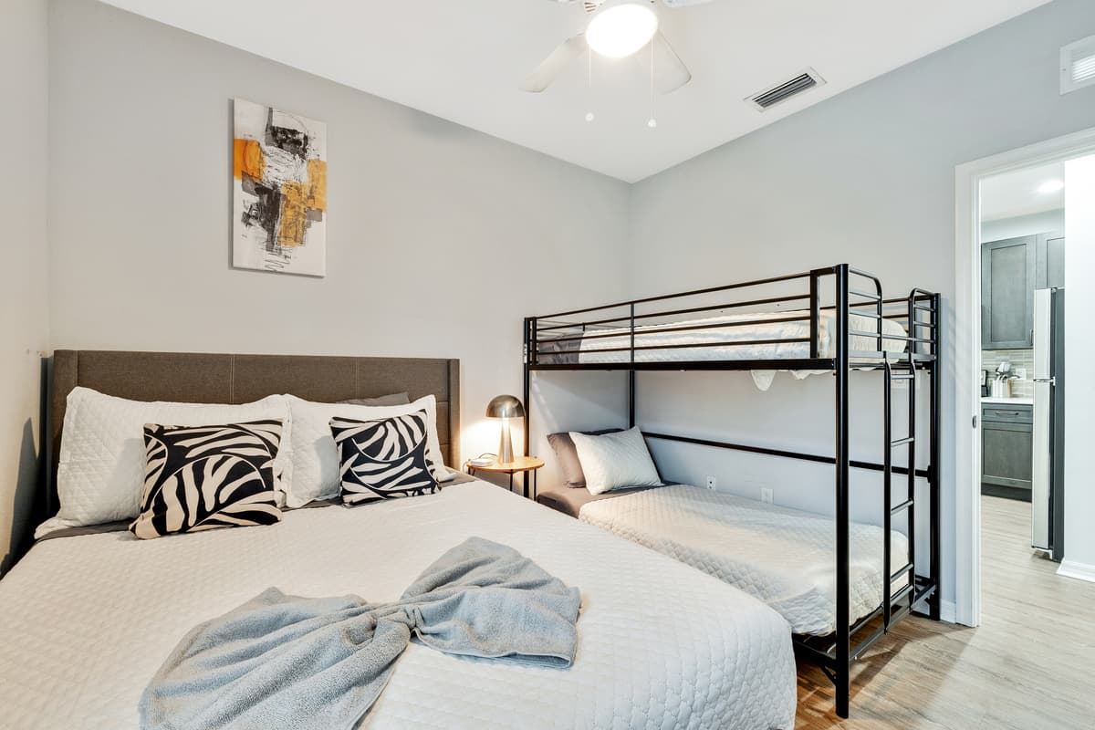 Adding a touch of versatility and whimsy, this Bedroom features a charming bunk bed, offering not only additional sleeping space but also a playful element to the room's ambiance.