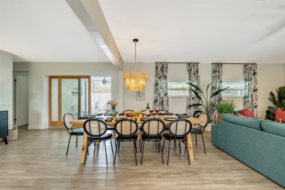 A stunning open dining space, adorned with a magnificent 10-seater wooden dining table that serves as the focal point of elegance and functionality.