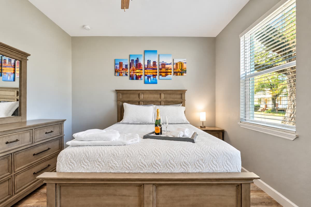This bedroom exudes a warm and inviting atmosphere that invites you to settle in and make yourself at home.