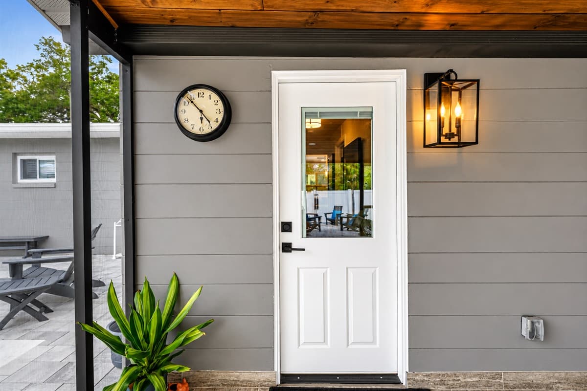 Convenient patio entrance leading directly to the screened outdoor entertaining area and poolside retreat.