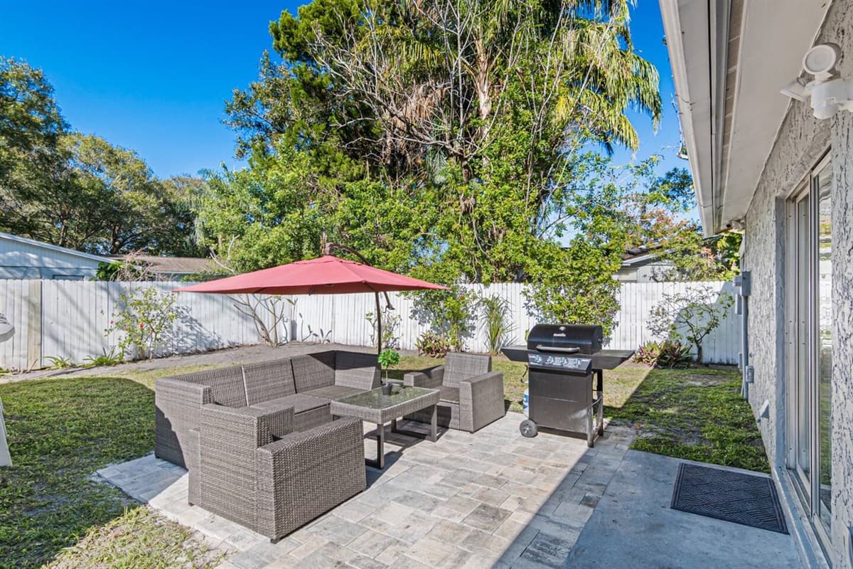Lovely backyard with comfortable seating area, umbrella and griller. Enjoy good food while bonding with family and friends. Don't hesitate and book this property now!