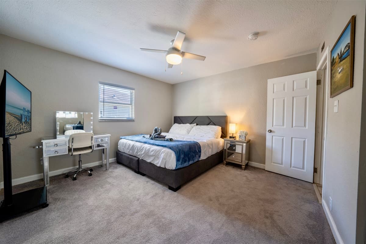 The centerpiece of this inviting bedroom is a luxurious king-size bed, promising a restful night's sleep and plenty of space to stretch out.