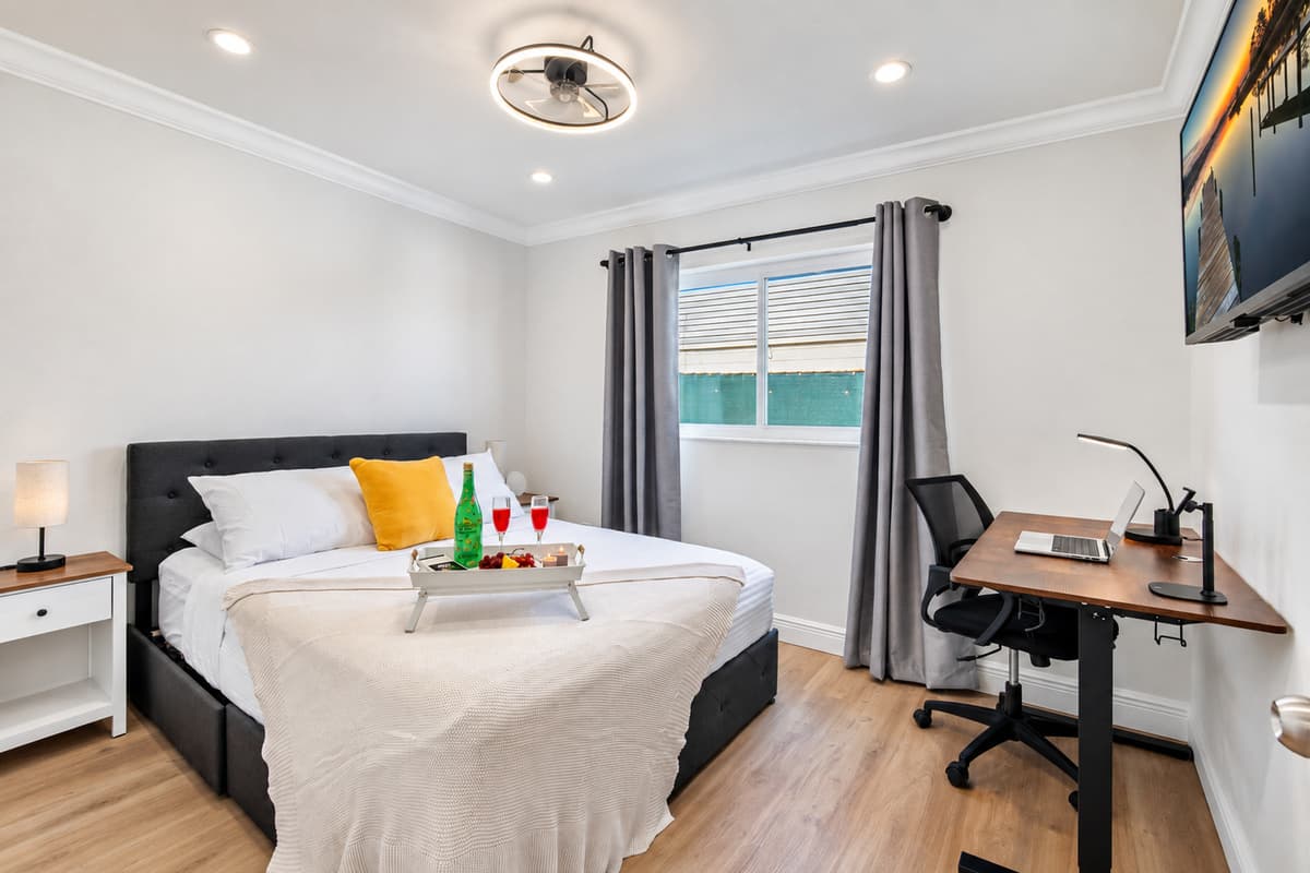Equipped with a dedicated workspace and comfy bed, this room balances productivity and relaxation beautifully.