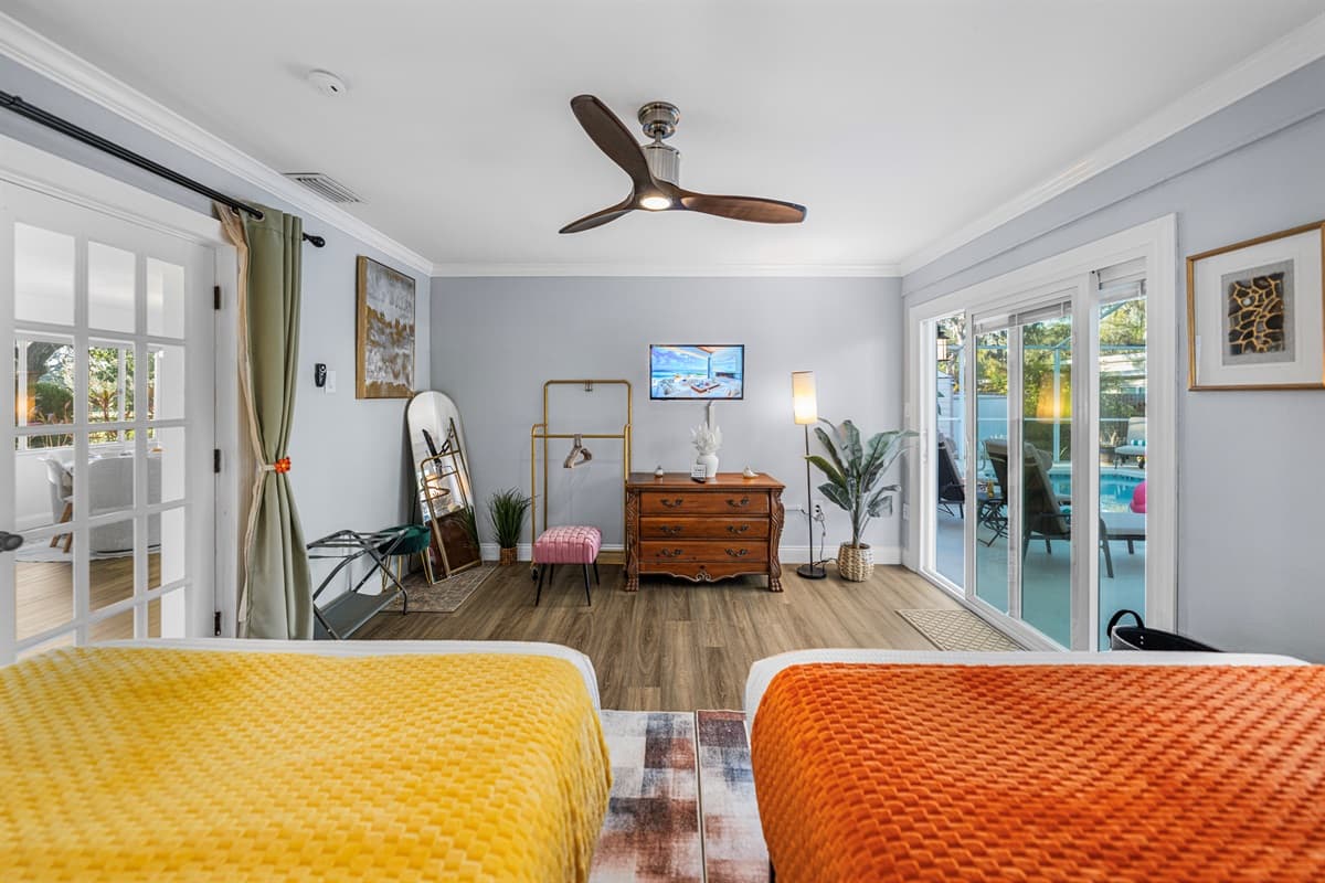 Designed for convenience and comfort, this bedroom includes two double beds in a clean, modern setting.